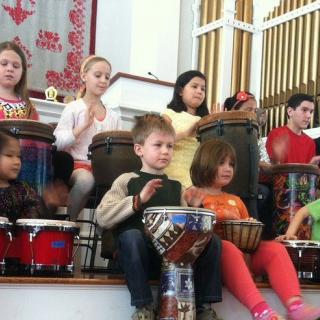 Children drumming at First parish UU Bedford, MA.