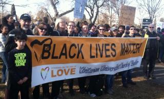 UUs holding Black Lives Matter banner witness for racial justice in Denver, CO, January 2015.