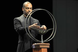 Rev. Carlton Smith lights the chalice.