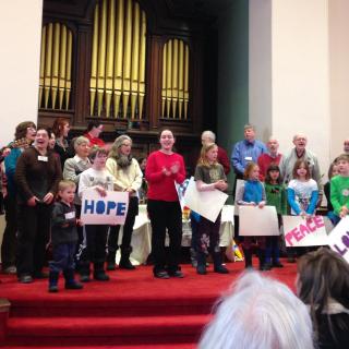 Congregation members sing at Multigenerational Worship at the UU Church of Montpelier VT.