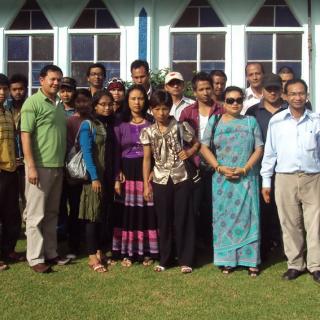 A group photo of Unitarians from the Khasi Hills in India, wearing colorful clothing.