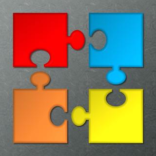Four colorful puzzle pieces ready to assemble